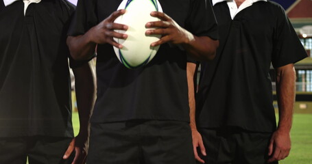Image of glowing lights over diverse rugby players in sports stadium