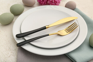 Beautiful table setting for Easter on light background