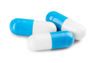 Antibiotic pills isolated on white. Medicinal treatment