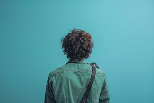 Portrait of a Young Boy with Curly Hair and Thoughtful Expression in Soft Natural Lighting nack view 