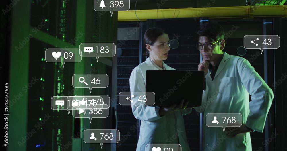 Poster image of social media icons and numbers over diverse it technicians by computer server