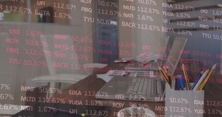 Image of financial data processing over office desk with laptops and tablet