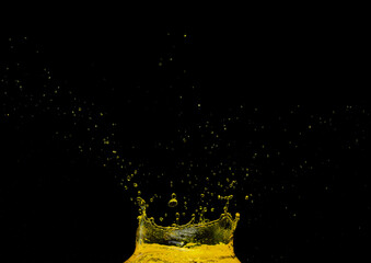 Lemon Juice beverage crown Water splash on object to create shape form fluttering in droplet and wave. Oil lubricant crown water to object make curve drop explosion. Black background isolated