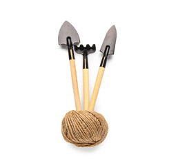 Wooden gardening tools and rope on white background. Top view