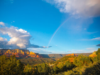 Sky rainbow in Arizona sunset. Panoramic mountains landscape with rainbow in the sky.