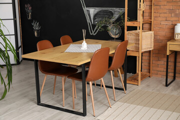 Dining table with chairs in room