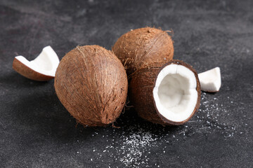 Fresh coconuts on black background