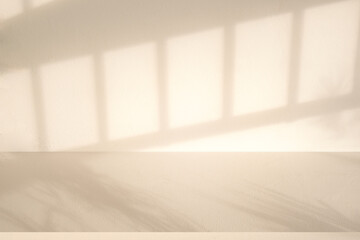 Wall interior background, studio and backdrops show products. with leaf shadow from window color beige and white. background for text insertion and presentation of product