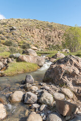 A rocky stream with a small waterfall