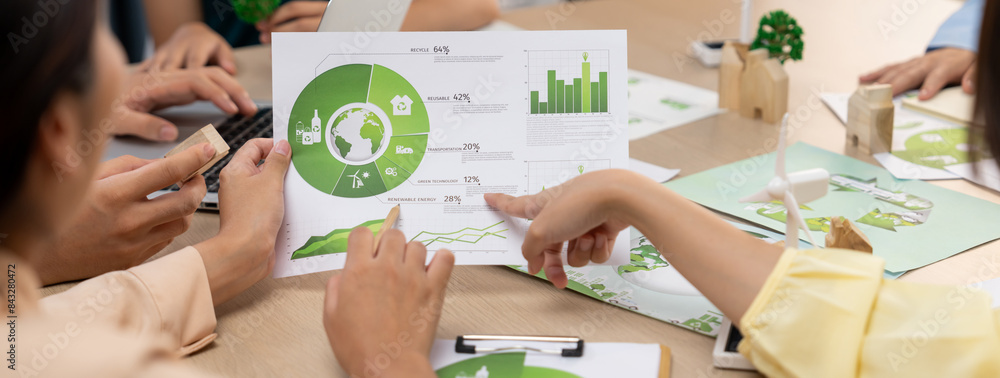 Poster professional businessman interested in invested in green businesses when he see rising graph on tabl