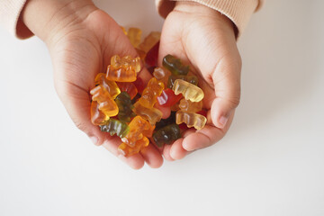 top vie wof colorful candy sweet jelly ion child hand 