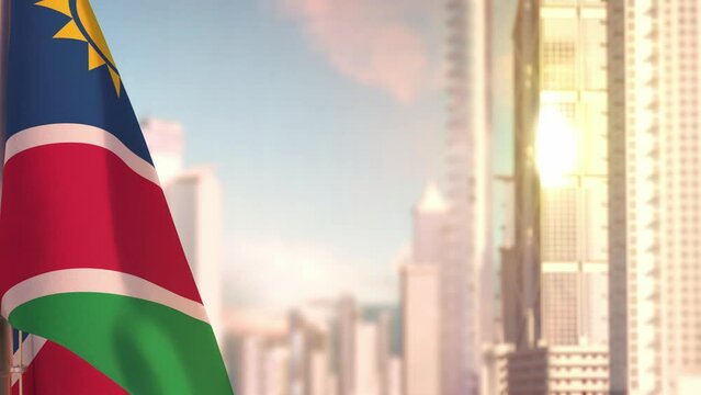 Namibia flag at sundown with modern city architecture