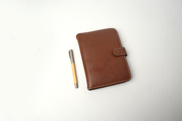 leather cover dairy or notebook with pen isolated 