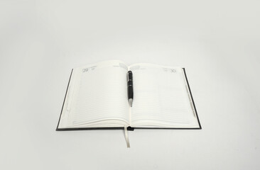 leather cover dairy or notebook with pen isolated 