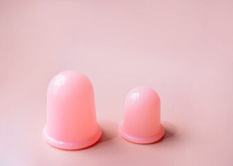 Pink silicone vacuum cups for anti-cellulite massage.