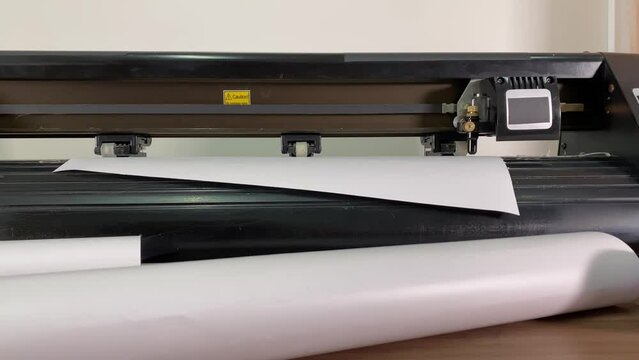 paper plotter. flatbed plotter. The flatbed plotter is broken. slow motion video. High-quality shooting in 4K format.