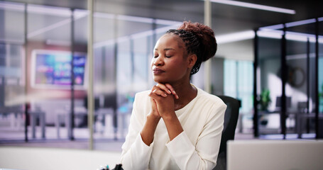 Spiritual African American woman seeking guidance from God through prayer