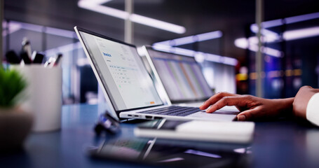 African American woman working on electronic invoices