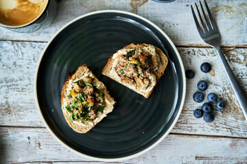 delicious homemade open face sandwich, topped with smashed sardine and olive oil