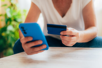 Online Shopping And Secure Payment.Close-up Of Hands With Credit Card And Phone For Online Payment.