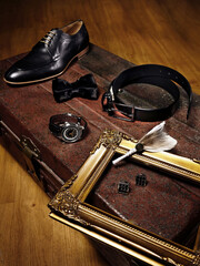Men Accessories Shoe, wrist watch, tie, belt, cufflink, being photographed aesthetically for content creation and design