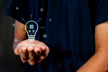 Hand with Artificial Intelligence light bulb. Idea from Artificial Intelligence concept with...