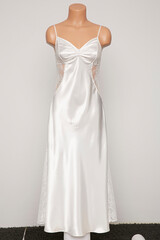 Fototapeta premium Satin female nighty on a white background.