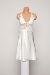 Fototapeta premium Satin female nighty on a white background.