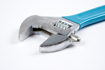 Adjustable wrench on an isolated white background.