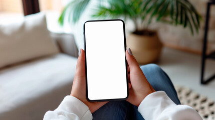 Mockup woman's hand holding using smart phone with white blank screen POV  at coffee shop, mobile app design and advertising, online marketing