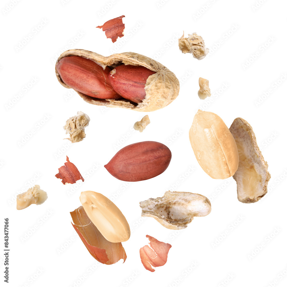 Wall mural peanuts and crushed pod in air on white background - Wall murals