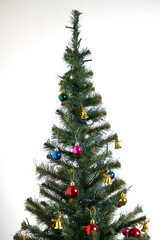 Detail of a Christmas tree with lights on isolated white background.