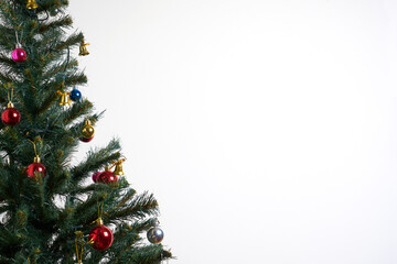 Detail of a Christmas tree with lights on isolated white background.