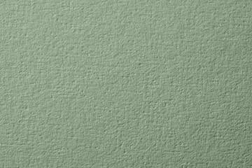 Sage green paper sheet as background, closeup