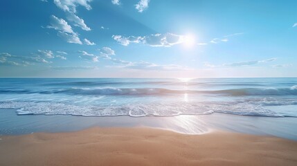 Obraz premium Wide panorama of a serene tropical beach with gentle waves under a clear blue sky, the sun hovers near the horizon.