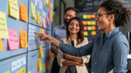 A female professional teaches Scrum Agile methodologies to a group of attentive adults using a colorful sticky note board.