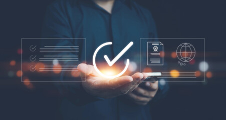 Quality ISO, ISO standards quality control, assurance and warranty business technology concept. Businessman using laptop computer with quality assurance and document icon for ISO, Standardization. 