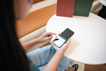 Asian woman using smartphone mobile addict spending time checking news social media cell telephone technology e-commerce concept