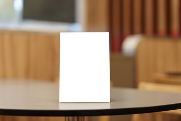 Menu mock up blank for text marketing promotion. Mock up Menu frame standing on wood table in restaurant space for text