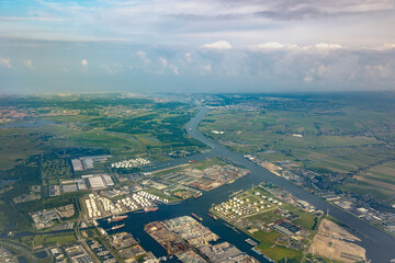 Aerial view of the North Sea canal, connecting the large port, harbour and docks of Amsterdam to the locks and the sea or ocean. Many ships transporting cargo in the Netherlands