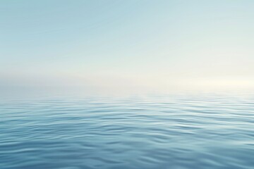 Obraz premium Minimalist image of calm ocean waters under a clear, blue sky, exuding tranquility and simplicity.