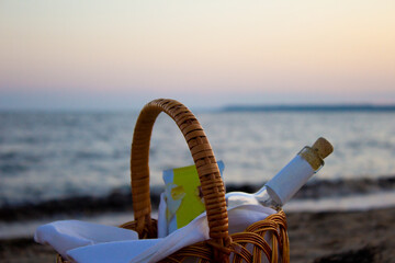 picnic setup with basket on sunny beach