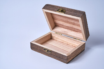 Handmade wooden gift box on a white isolated background.