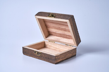 Handmade wooden gift box on a white isolated background.