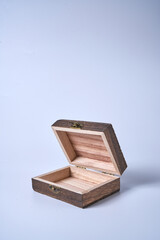 Handmade wooden gift box on a white isolated background.