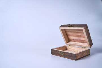 Handmade wooden gift box on a white isolated background.