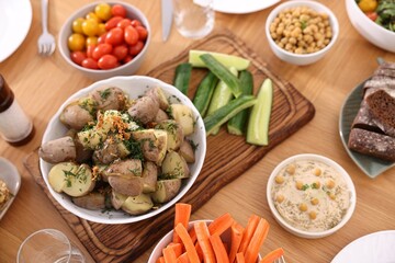 Healthy vegetarian food on wooden table, above view