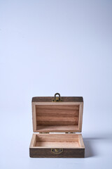 Handmade wooden gift box on a white isolated background.