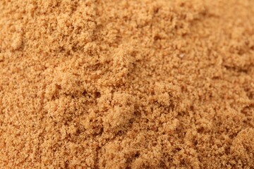 Brown coconut sugar as background, closeup view