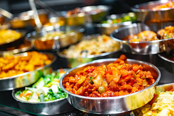 Traditional Asian dishes sold in a food court in Singapore